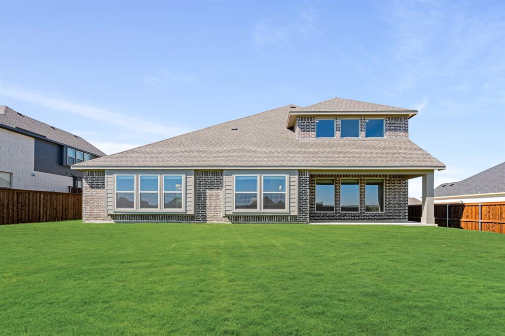 11716 Flathead Court Godley, TX 76044 - Photo 39 of 40 a front view of house with a garden
