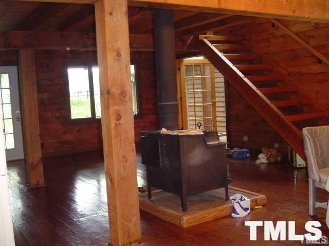 8212 Ridgeback Road Apex, NC 27523 - Photo 2 of 7 a view of a hallway with wooden floor and stairs
