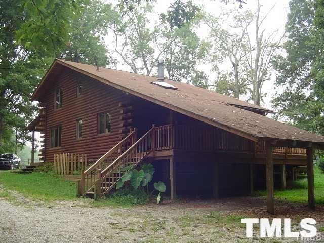 8212 Ridgeback Road Apex, NC 27523 - Photo 7 of 7 a backyard of a house with plants and large tree