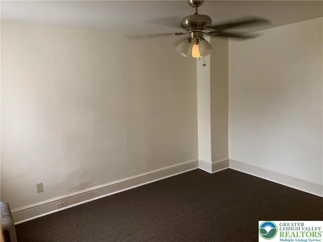 a view of a small space with wooden floor