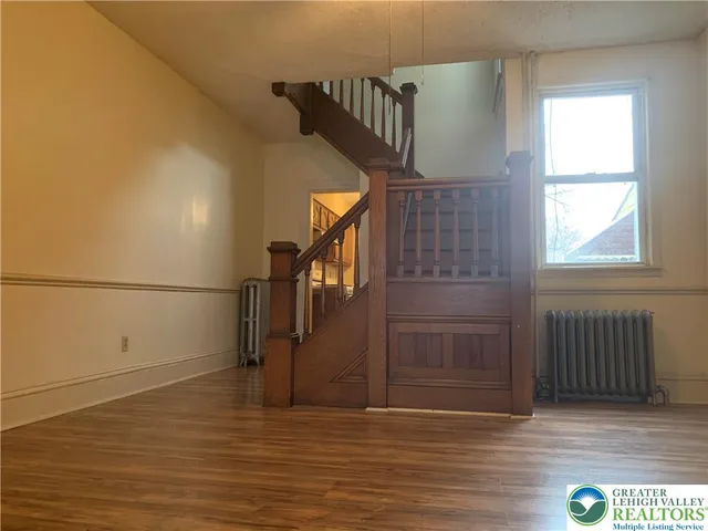 a view of entryway with wooden floor