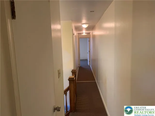 a view of hallway with stairs