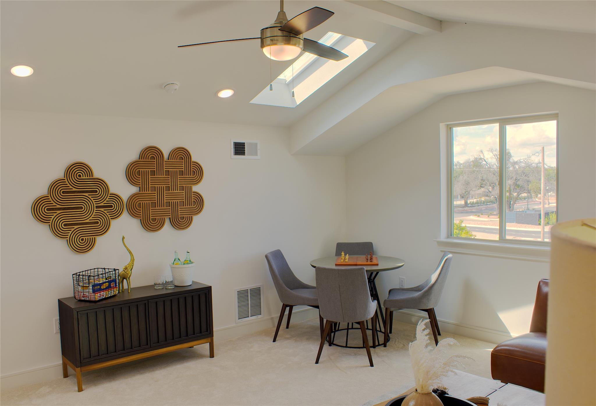300 Tesla Circle Austin, TX 78681 - Photo 18 of 39 Vaulted ceilings featuring exposed beams and skylights complement recessed lighting and a ceiling fan