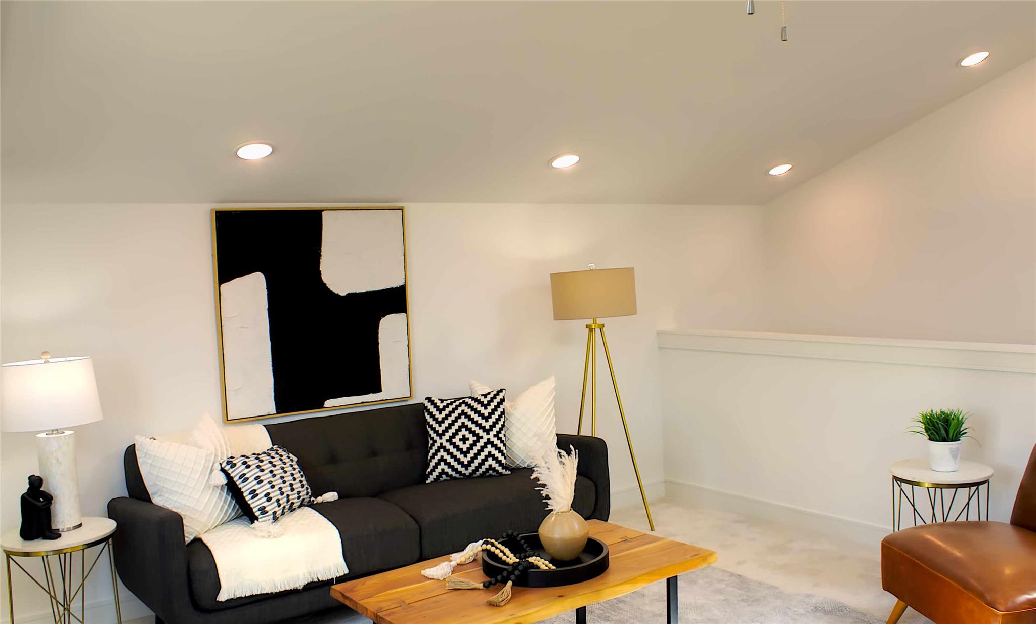 300 Tesla Circle Austin, TX 78681 - Photo 20 of 39 Recessed lighting illuminates the space, featuring white walls, an angled ceiling, and light-colored flooring