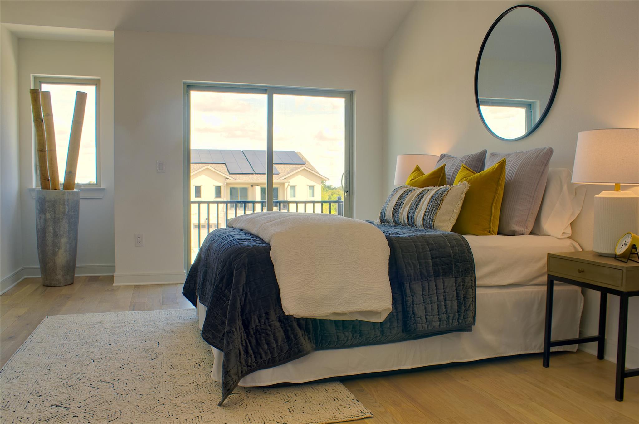 300 Tesla Circle Austin, TX 78681 - Photo 21 of 39 Bedroom featuring light wood-finish flooring and a white color palette