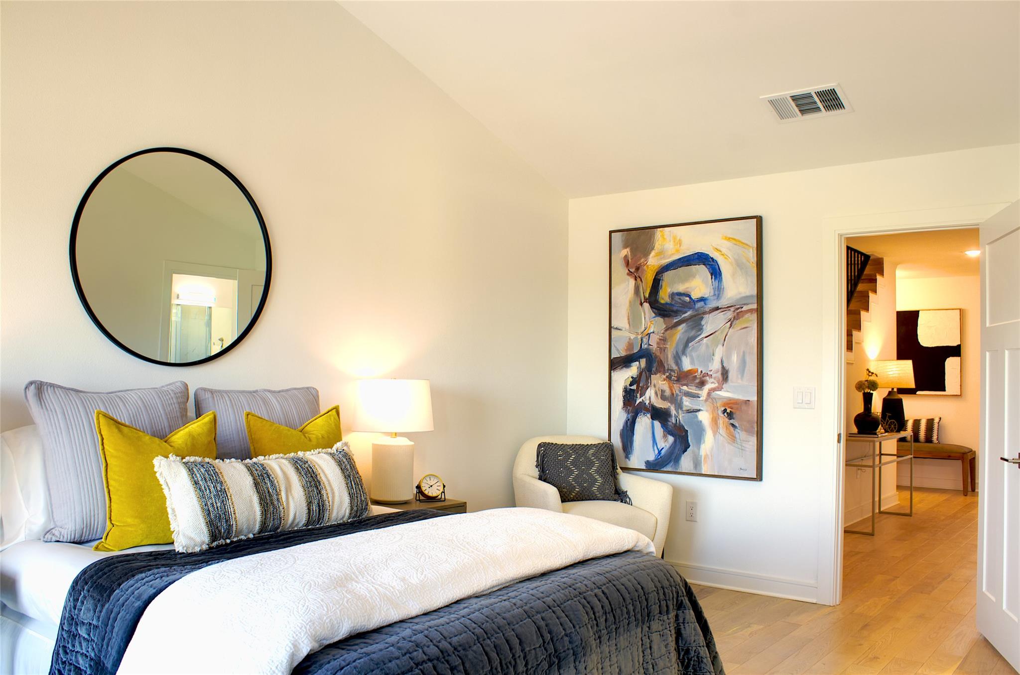 300 Tesla Circle Austin, TX 78681 - Photo 23 of 39 Bright room with vaulted ceilings, featuring light wood-finish flooring, recessed lighting, and a white paneled door