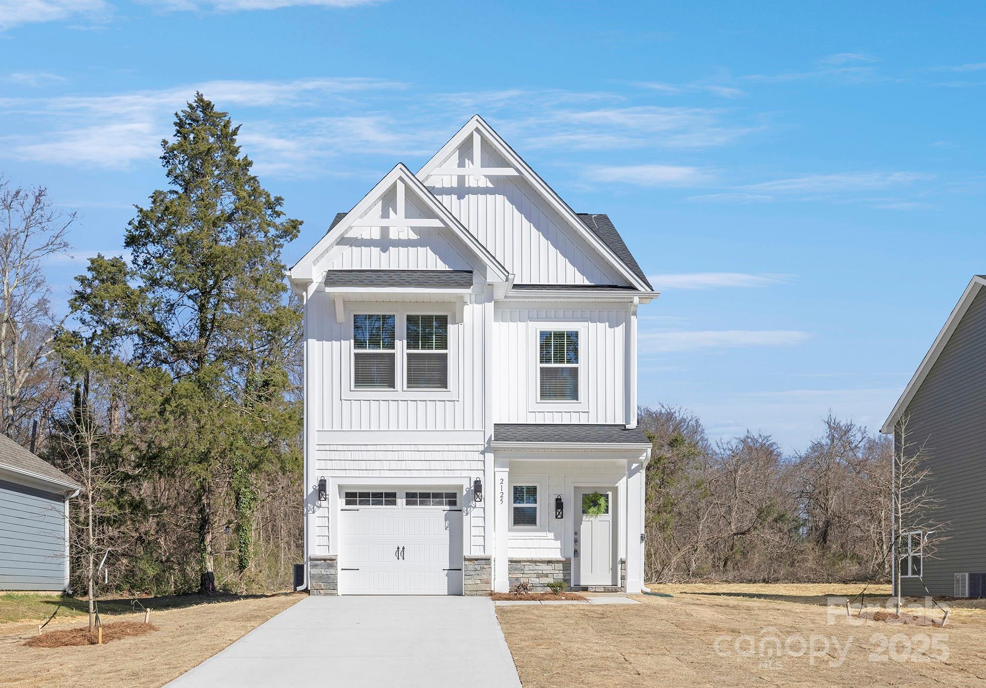 2125 Tom Sadler Road, Unit 7159 Charlotte, NC 28214 - Photo 1 of 26 a view of a big house with a street