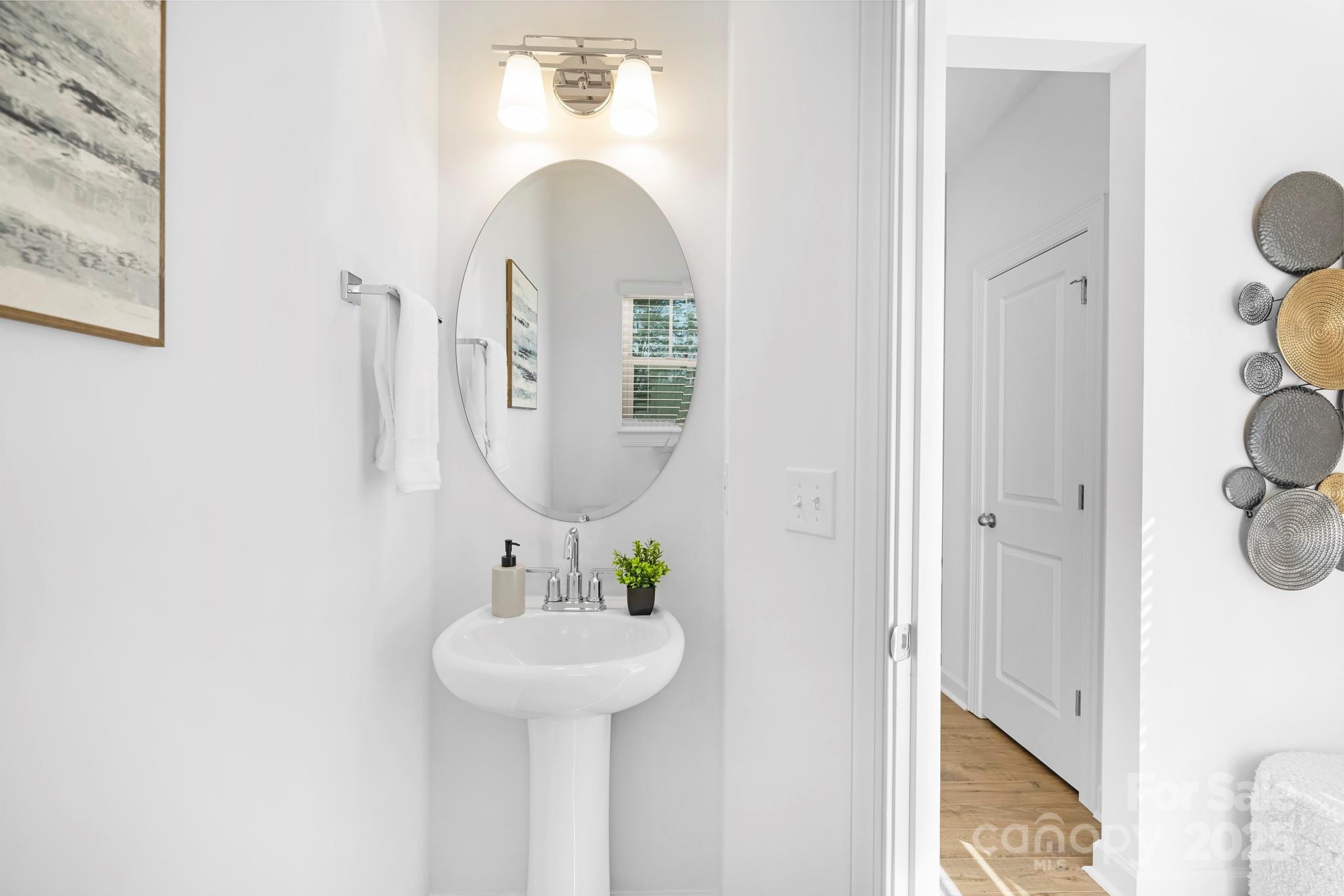 2125 Tom Sadler Road, Unit 7159 Charlotte, NC 28214 - Photo 12 of 26 a bathroom with a sink and a mirror