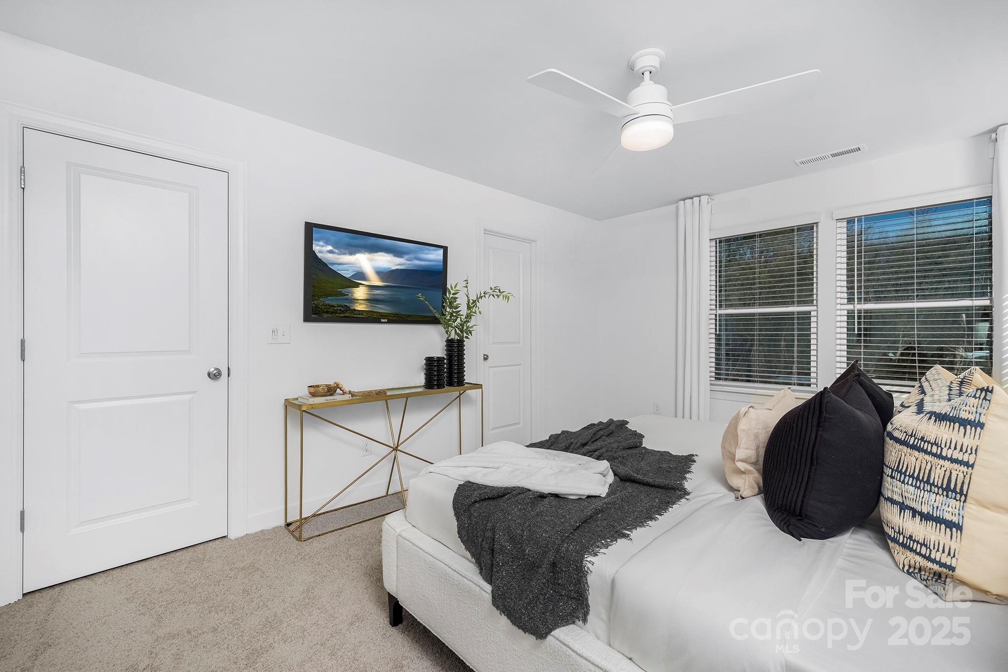 2125 Tom Sadler Road, Unit 7159 Charlotte, NC 28214 - Photo 15 of 26 a living room with furniture a ceiling fan and a window