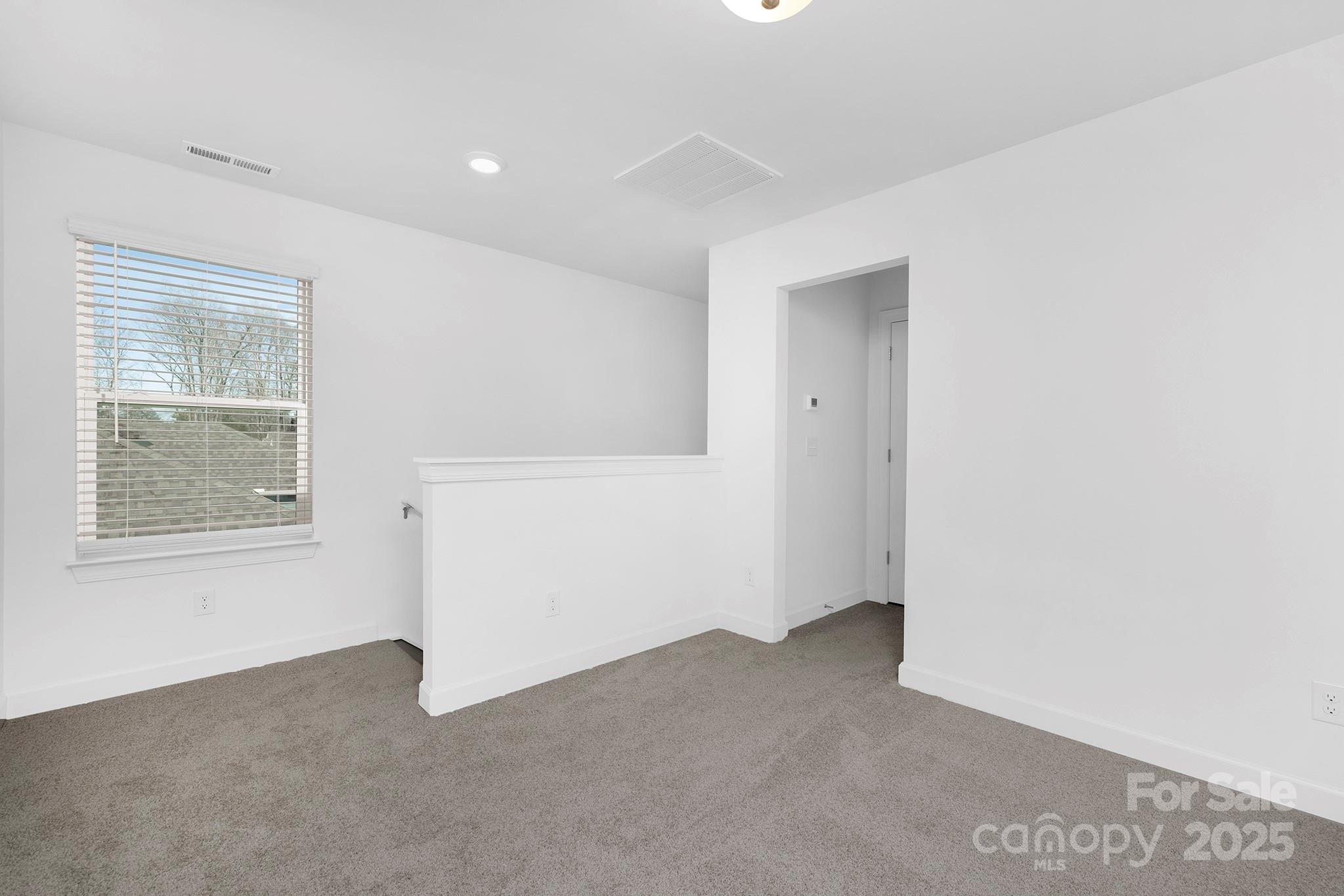 2125 Tom Sadler Road, Unit 7159 Charlotte, NC 28214 - Photo 16 of 26 an empty room with a window