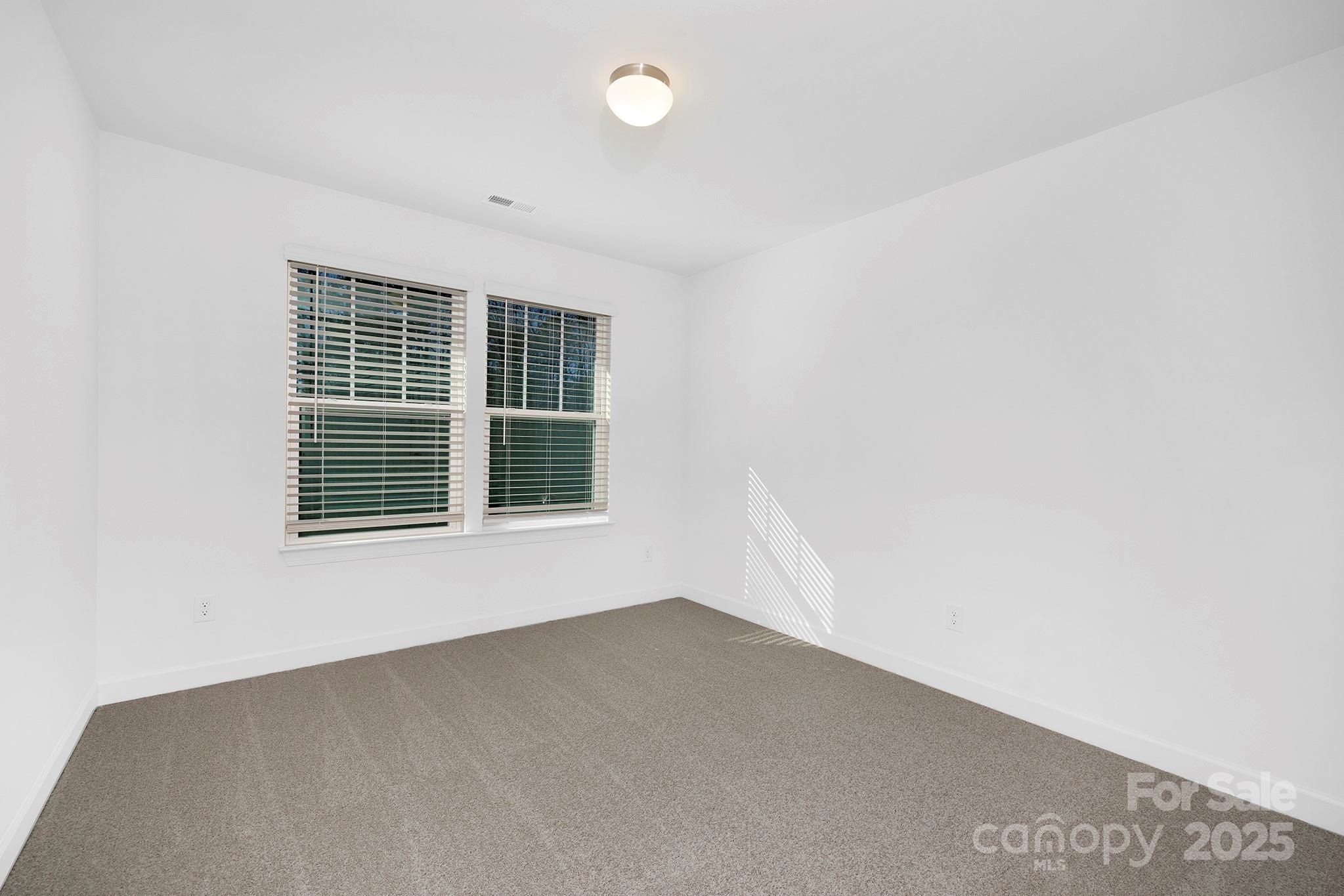 2125 Tom Sadler Road, Unit 7159 Charlotte, NC 28214 - Photo 18 of 26 an empty room with a window