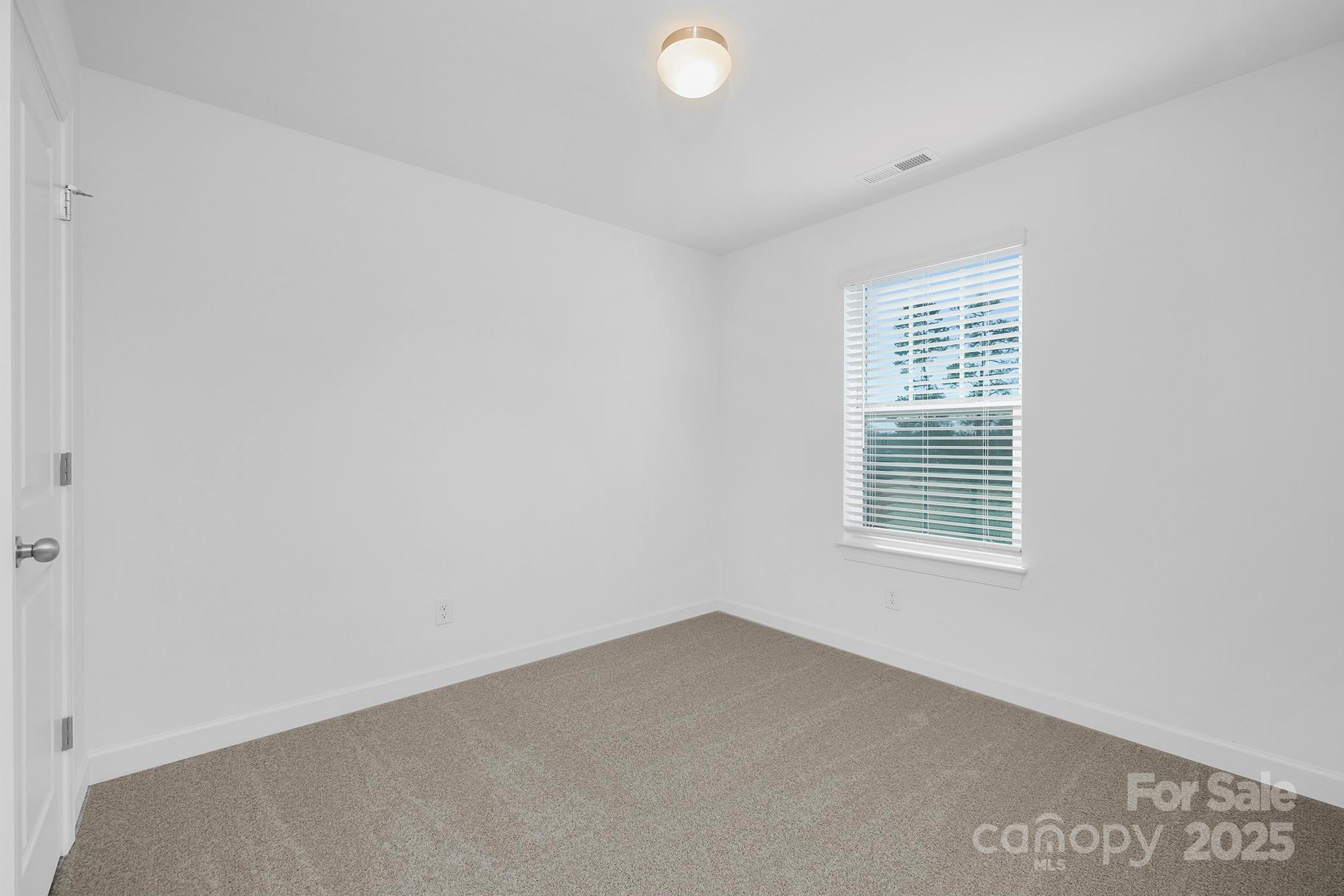 2125 Tom Sadler Road, Unit 7159 Charlotte, NC 28214 - Photo 19 of 26 an empty room with a window