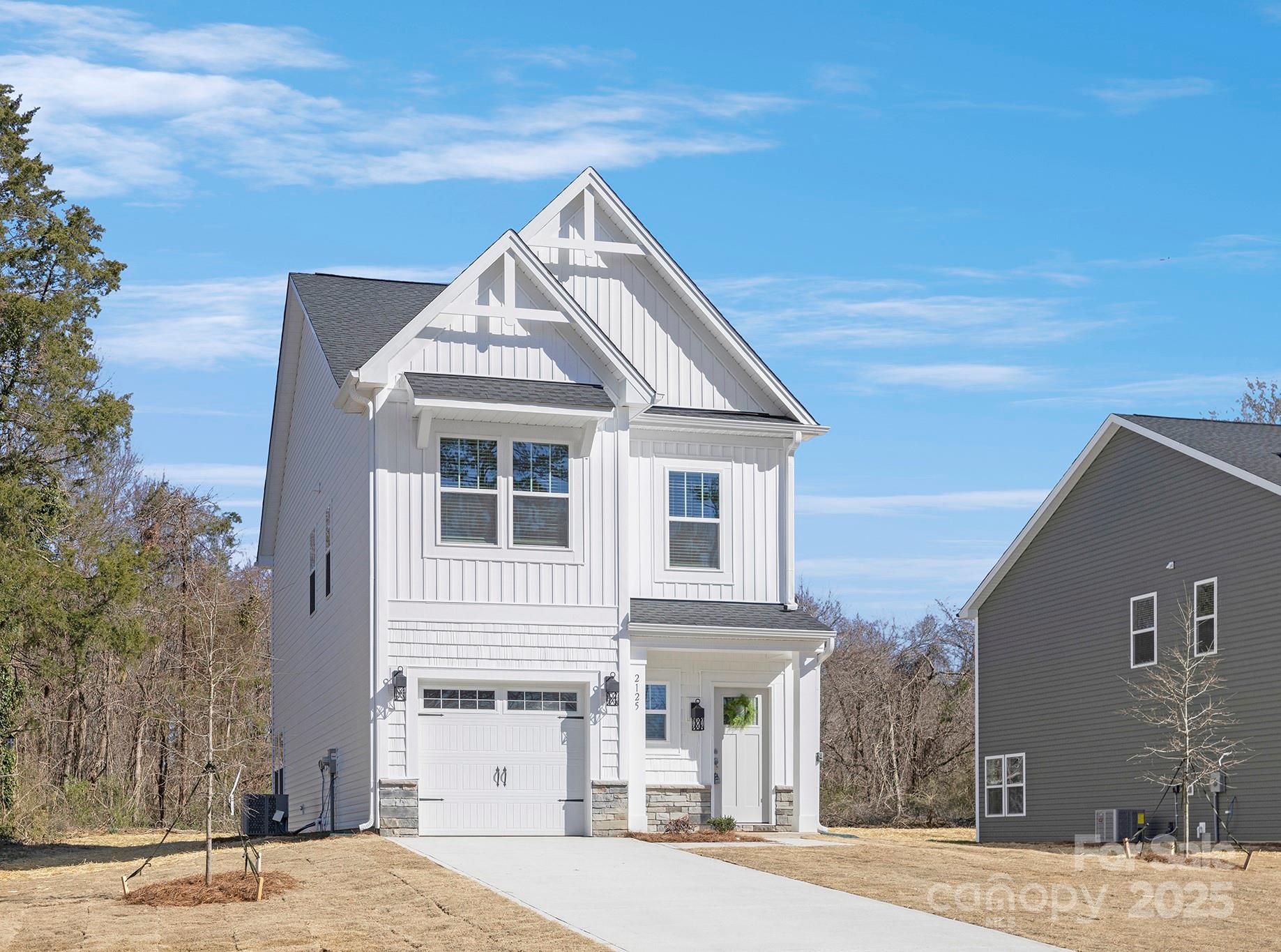 2125 Tom Sadler Road, Unit 7159 Charlotte, NC 28214 - Photo 2 of 26 a front view of a house with a yard