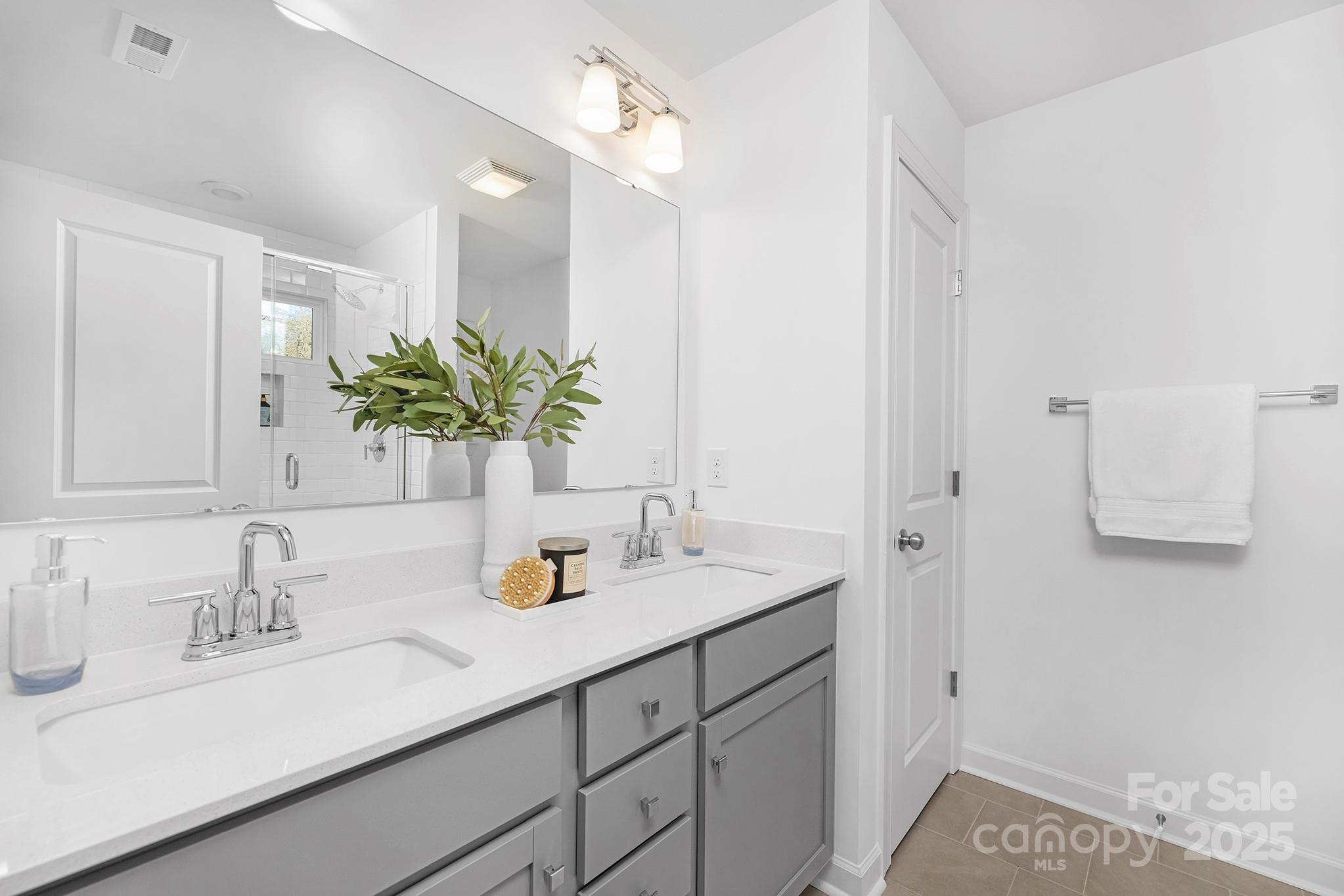 2125 Tom Sadler Road, Unit 7159 Charlotte, NC 28214 - Photo 21 of 26 a bathroom with a sink double vanity granite and a mirror