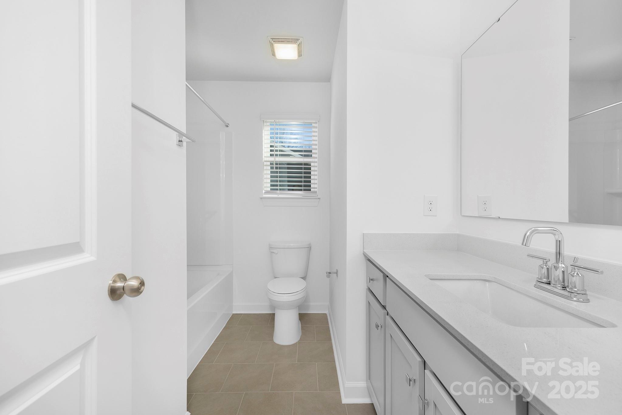 2125 Tom Sadler Road, Unit 7159 Charlotte, NC 28214 - Photo 23 of 26 a bathroom with a sink toilet and shower