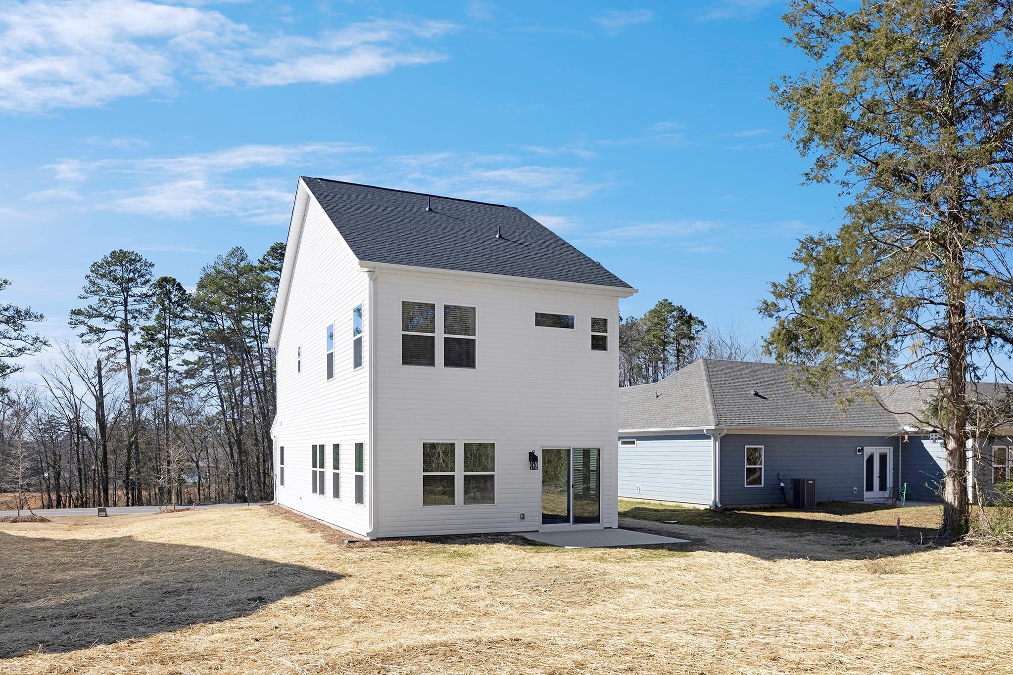 2125 Tom Sadler Road, Unit 7159 Charlotte, NC 28214 - Photo 24 of 26 a front view of a house with a yard