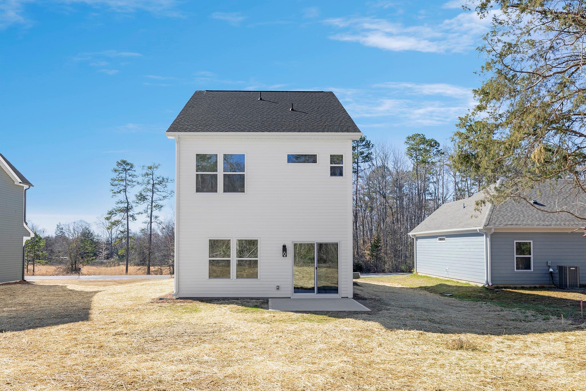 2125 Tom Sadler Road, Unit 7159 Charlotte, NC 28214 - Photo 25 of 26 a front view of a house with a yard covered in snow