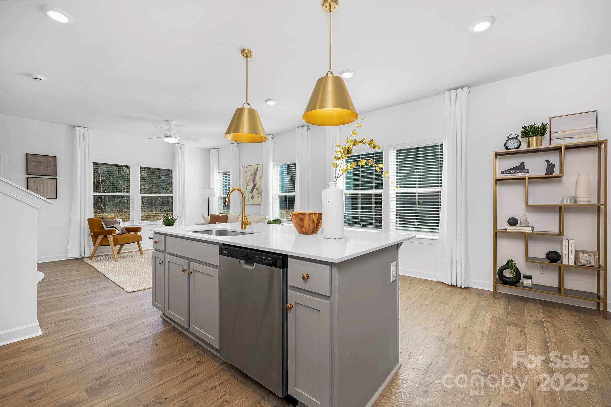 2125 Tom Sadler Road, Unit 7159 Charlotte, NC 28214 - Photo 4 of 26 a kitchen with stainless steel appliances granite countertop a sink a stove and a wooden floors