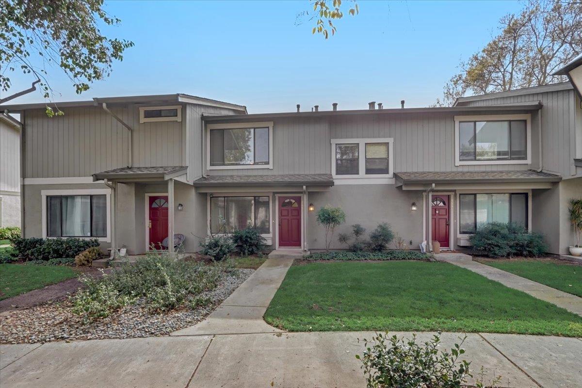 a front view of a house with garden