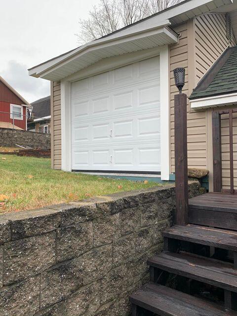 29 Somerset Street Millinocket, ME 04462 - Photo 6 of 38 garage door for storage back of garage