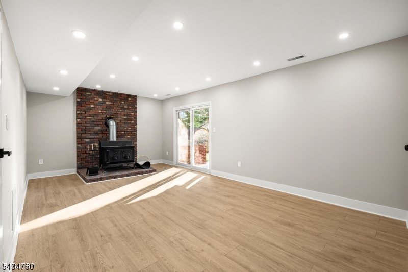 641 Ydv-ham Sq Road Robbinsville, NJ 08691 - Photo 25 of 49 a view of an empty room with wooden floor and a window