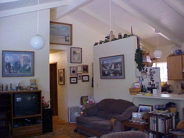 2483 Lilikoi Road Haiku, HI 96708 - Photo 4 of 4 a living room with furniture and wooden floor