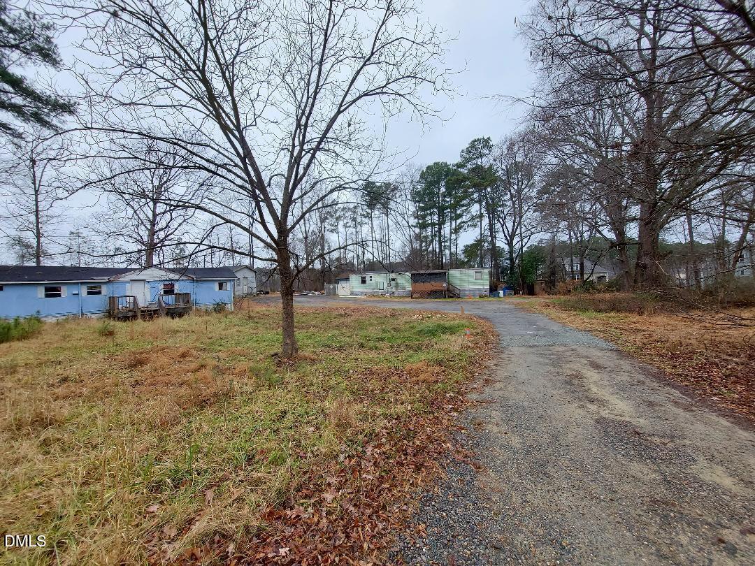 3020 Holland Road Apex, NC 27502 - Photo 18 of 19 a view of large yard with large trees