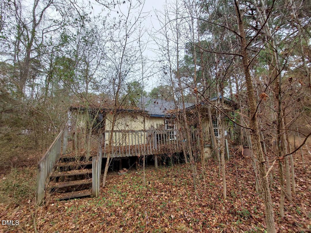 3020 Holland Road Apex, NC 27502 - Photo 19 of 19 a view of a yard with plants and a bench