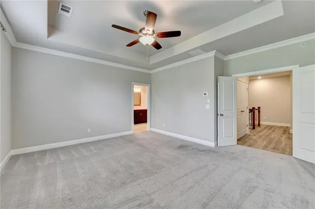 an empty room with closet and window