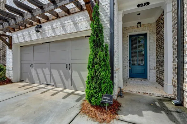 a front view of a house with a garage