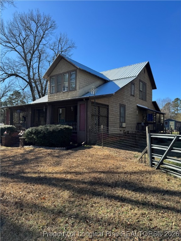 159 Zimmerman Road Sanford, NC 27330 - Photo 2 of 21 a front view of a house with a yard
