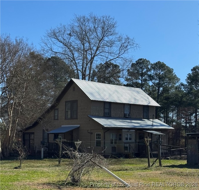 159 Zimmerman Road Sanford, NC 27330 - Photo 4 of 21 a front view of a house with a yard