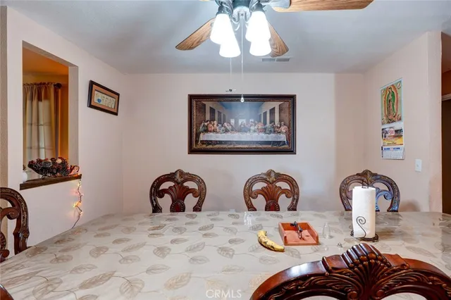a bedroom with furniture and a wooden floor