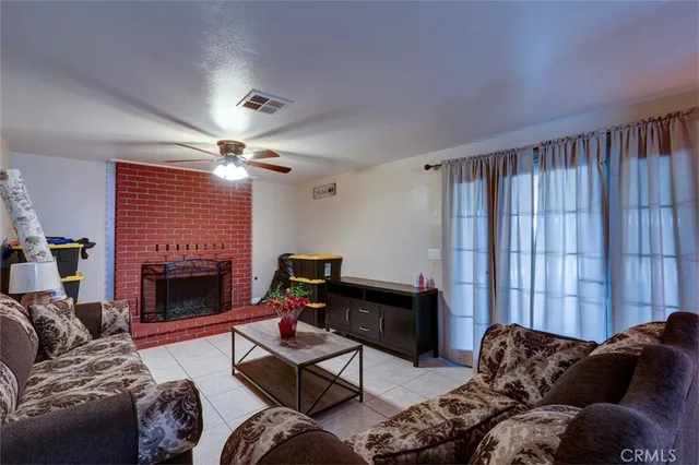 a living room with furniture windows and a fireplace