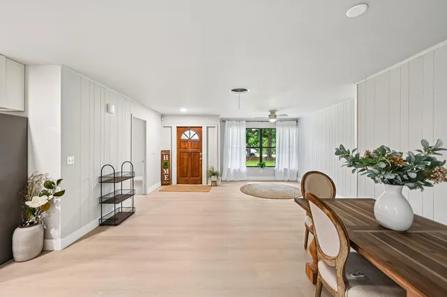 a view of a chair and table in the kitchen