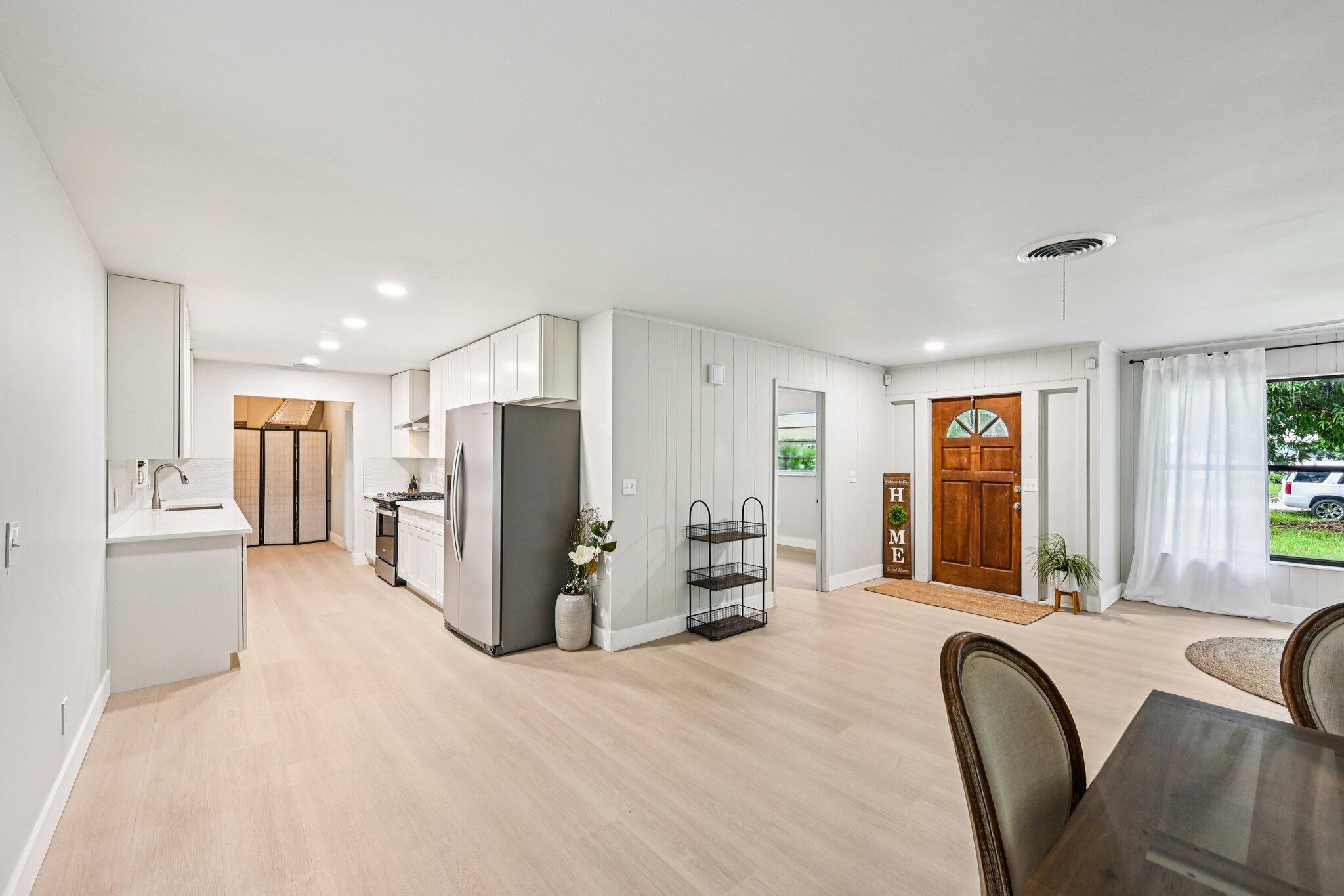 5852 Southeast Wesley Avenue Stuart, FL 34997 - Photo 14 of 27 a view of kitchen with furniture and large window
