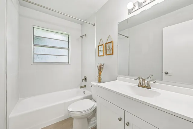 a bathroom with a sink a toilet and a bathtub