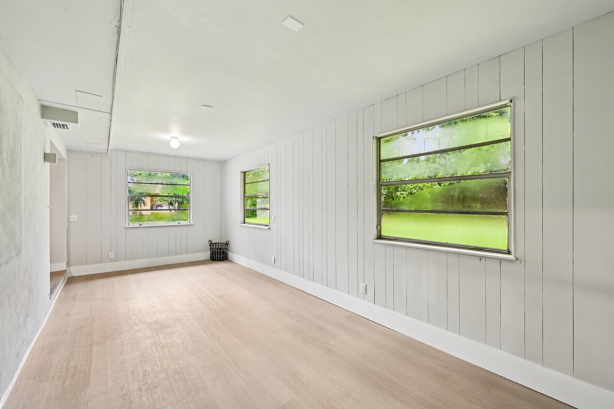 5852 Southeast Wesley Avenue Stuart, FL 34997 - Photo 20 of 27 an empty room with windows