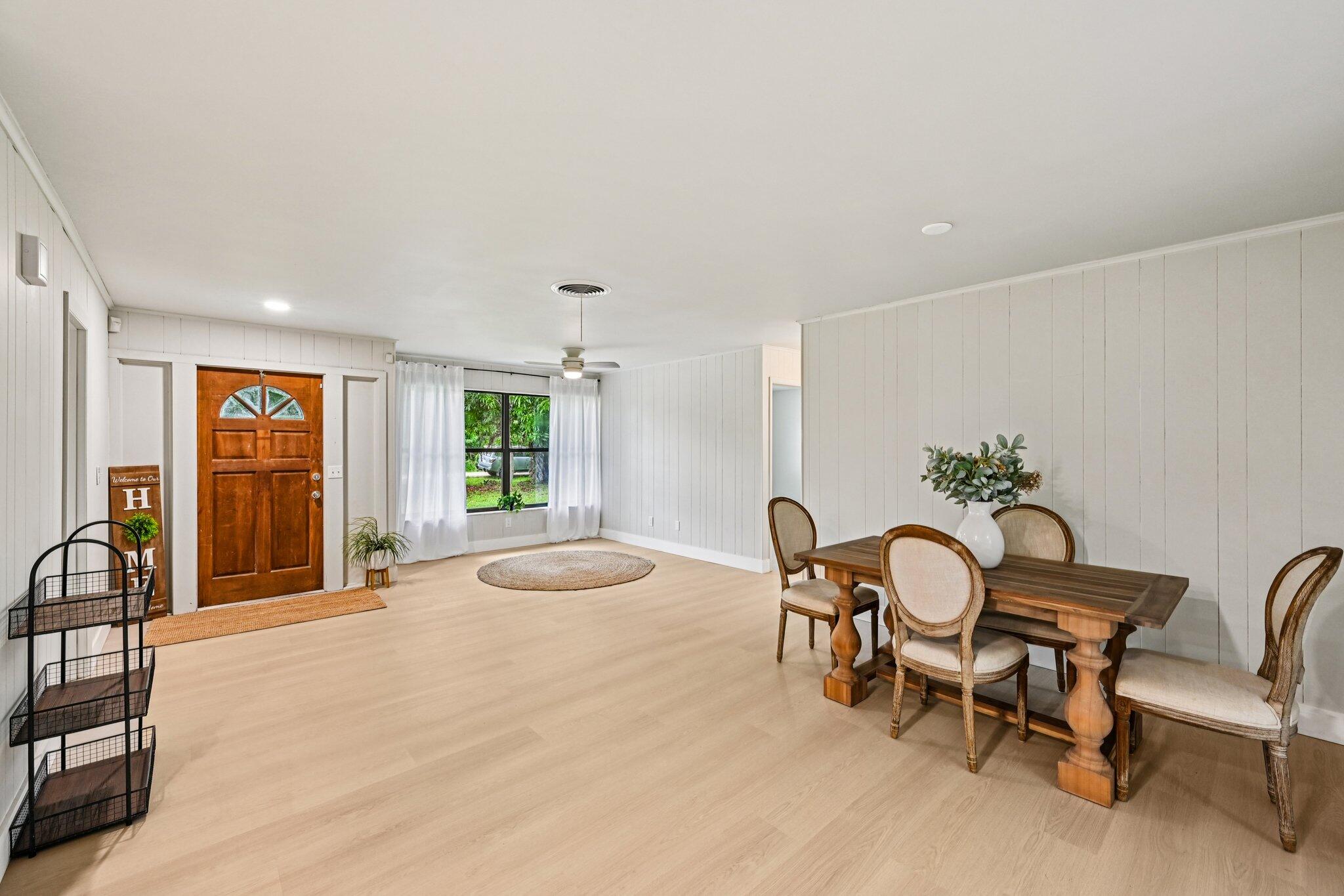 5852 Southeast Wesley Avenue Stuart, FL 34997 - Photo 3 of 27 a dining room with furniture and window
