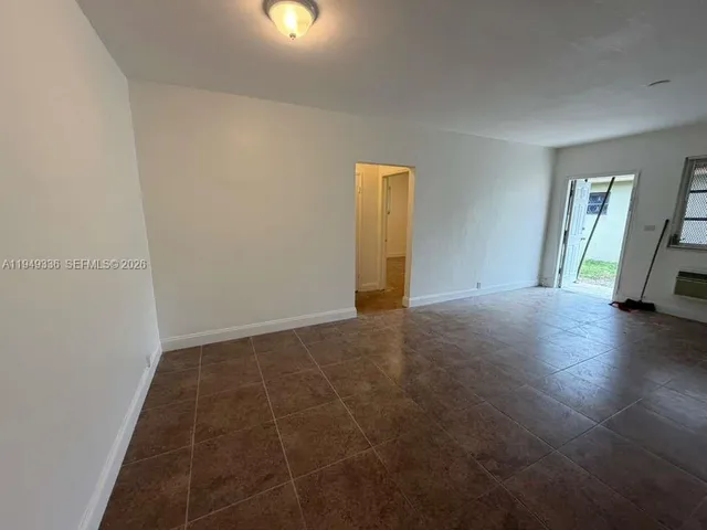a view of an empty room and window