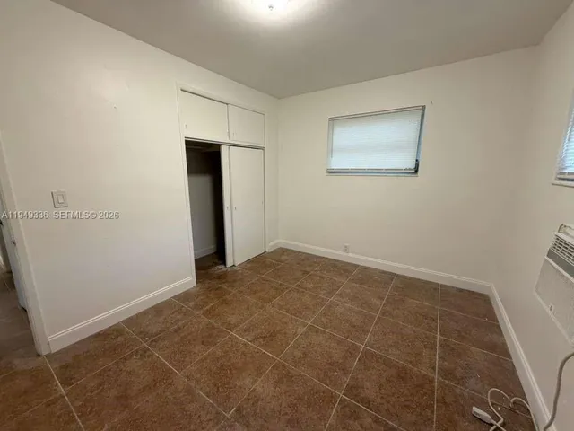 an empty room with a bathroom