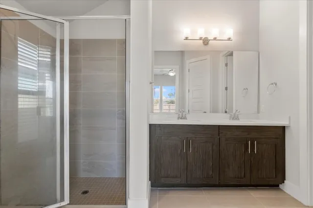 a bathroom with a double vanity sink and a mirror