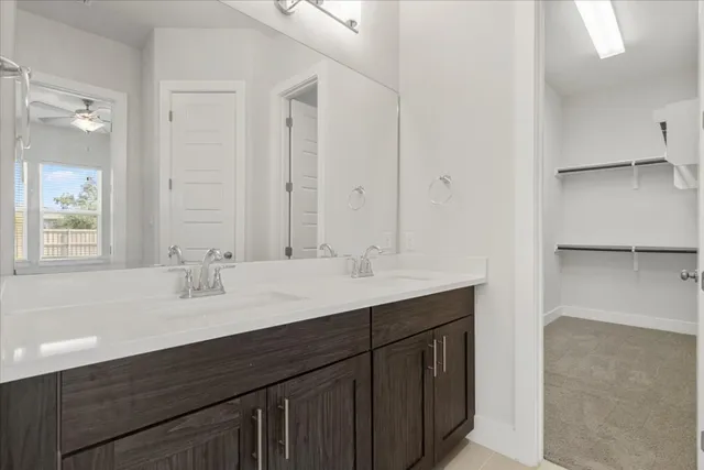 a bathroom with 2 sink and a mirror