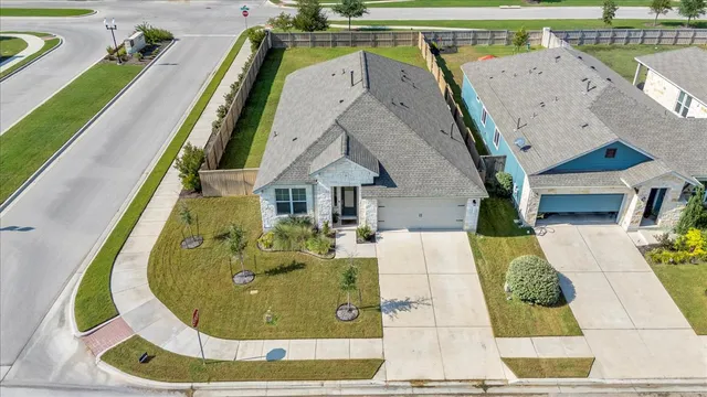 an aerial view of a house with swimming pool