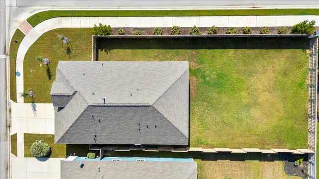 a aerial view of a house with a swimming pool