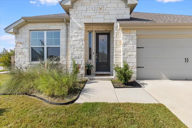 a view of a backyard with potted plants