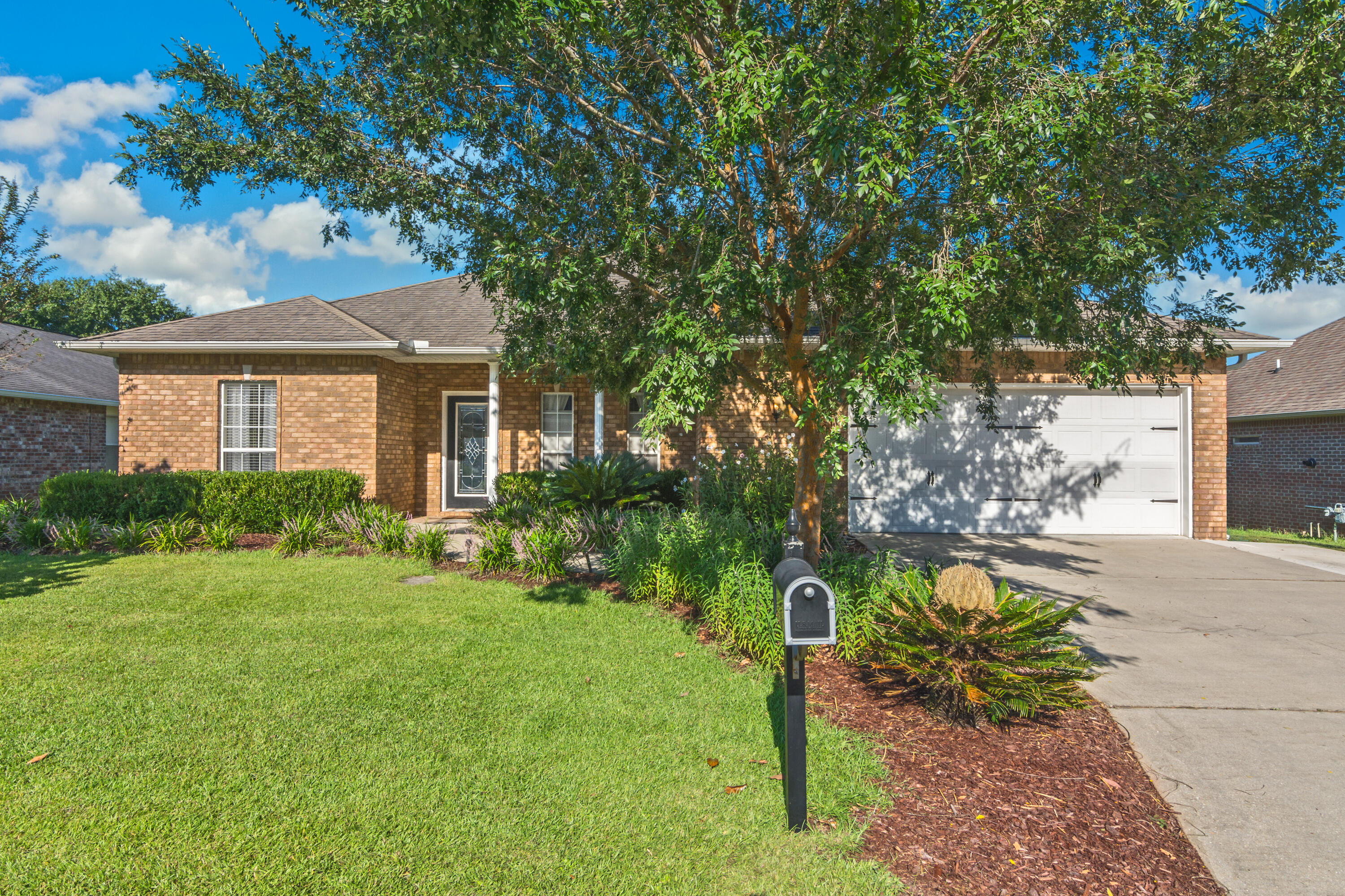 4631 Hermosa Road Crestview, FL 32539 - Photo 3 of 42 a front view of a house with a yard