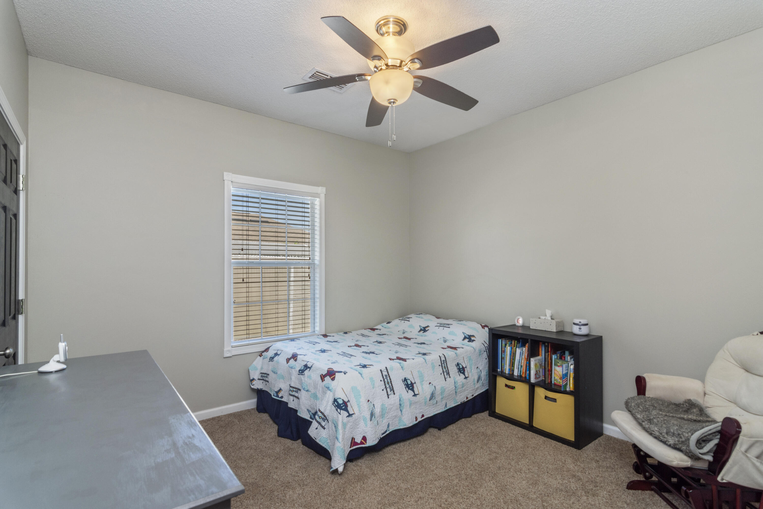 4631 Hermosa Road Crestview, FL 32539 - Photo 35 of 42 a bedroom with a bed and a window