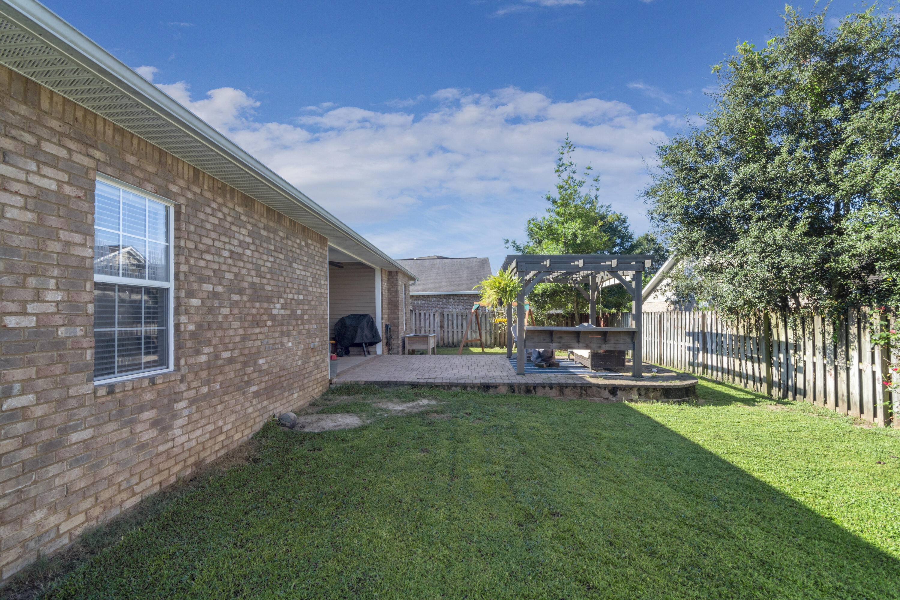 4631 Hermosa Road Crestview, FL 32539 - Photo 8 of 42 a view of a house with a yard porch and sitting area