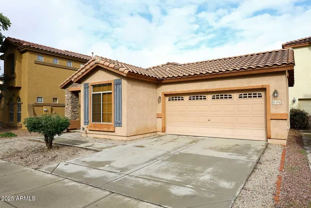 a front view of a house with a garage